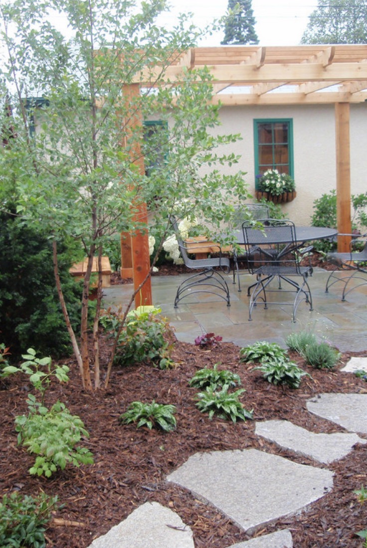 Mulch under perennials and stepping stones for a finished look