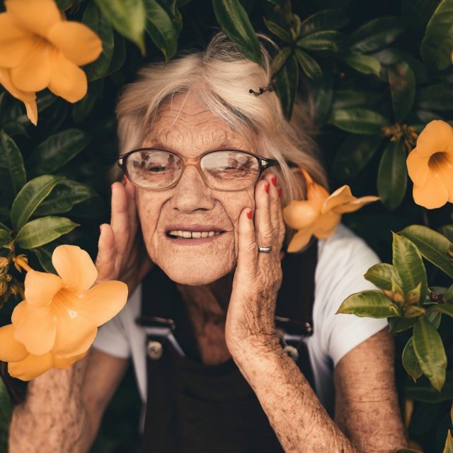 elderly woman in flowers